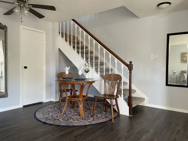 a view of entryway dining room and hall with wooden floor