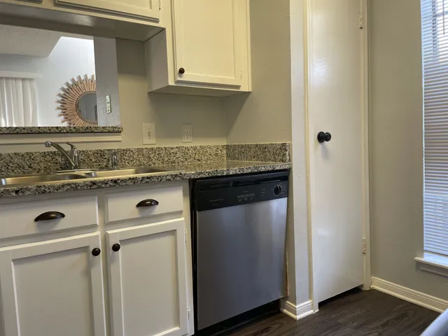 a view of a sink and a mirror