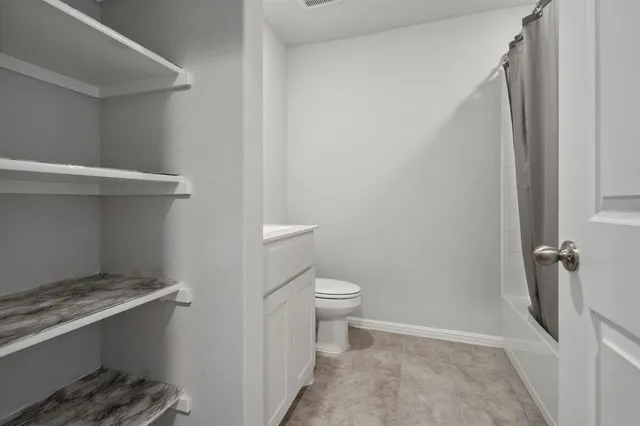 a bathroom with a sink and toilet