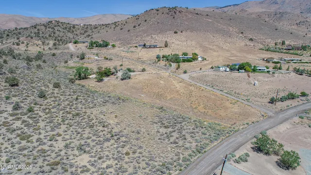 an aerial view of beach and a mountain view
