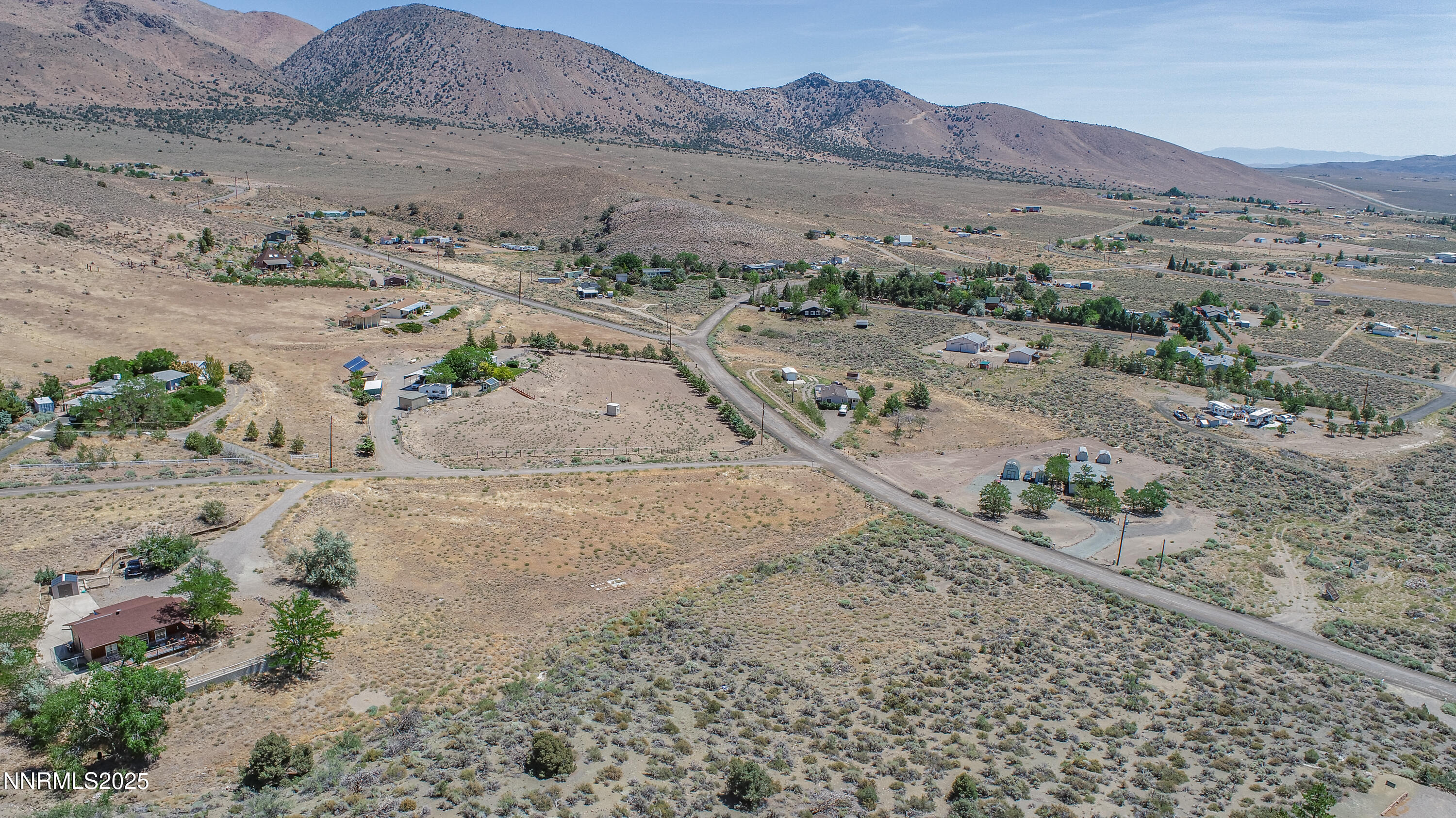 3955 Mica Court Topaz Ranch Estates, NV 89444 - Photo 15 of 26 a view of a dry field with mountains in the background