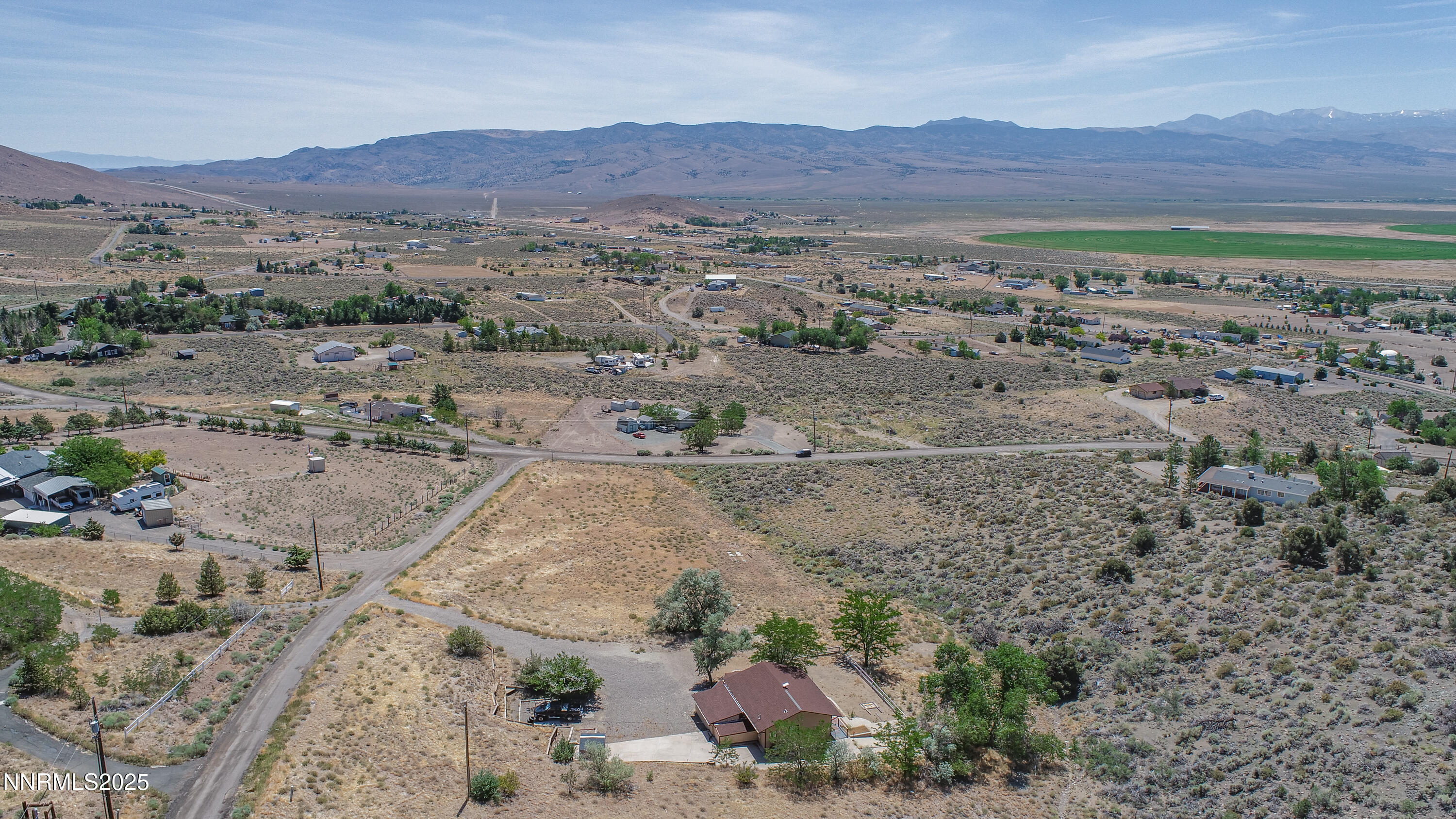 3955 Mica Court Topaz Ranch Estates, NV 89444 - Photo 17 of 26 a view of a field with mountains in the background