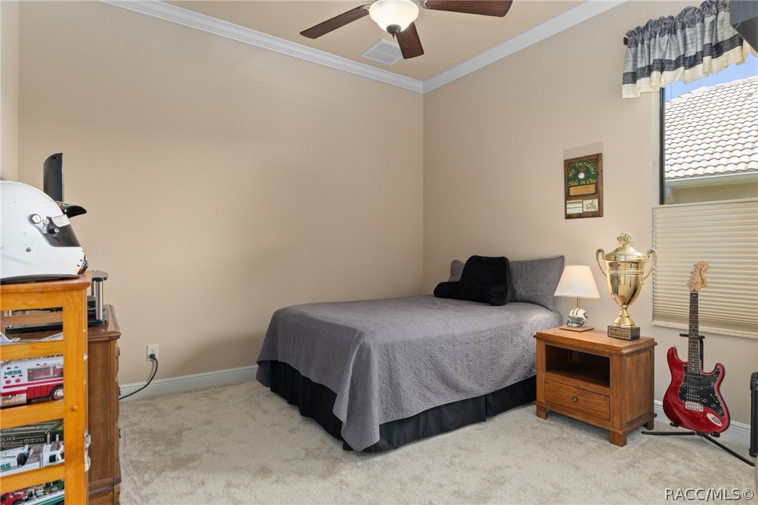 2015 North Rhodes Point Hernando, FL 34442 - Photo 26 of 82 The generous Guest Bedroom provides room for a larger bed and furniture. It also features crown molding.