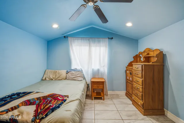 a bedroom with a bed and a cabinets