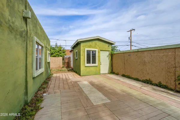 a view of a back yard of the house