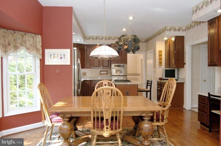 3731 North Glebe Road Arlington, VA 22207 - Photo 12 of 27 a view of a dining room with furniture and chandelier