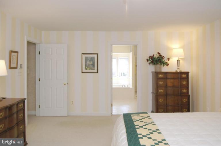 3731 North Glebe Road Arlington, VA 22207 - Photo 18 of 27 a bedroom with a bed and a cabinets