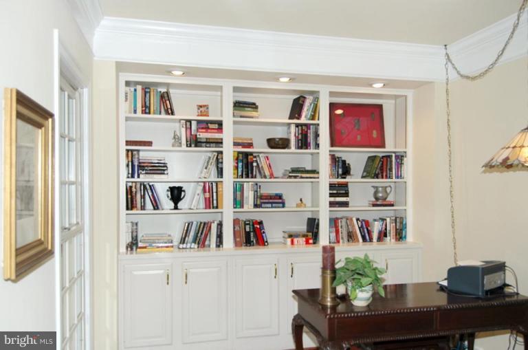 3731 North Glebe Road Arlington, VA 22207 - Photo 3 of 27 a room with furniture a bookshelf and a window