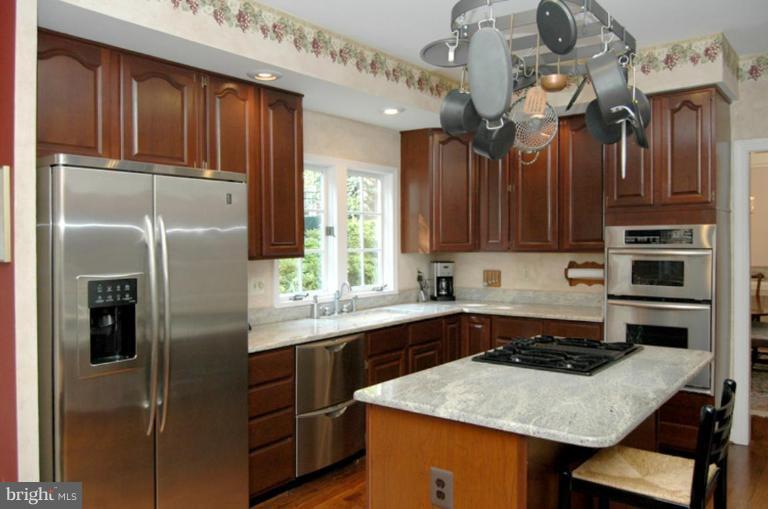 3731 North Glebe Road Arlington, VA 22207 - Photo 8 of 27 a kitchen with cabinets and a refrigerator
