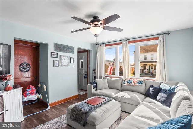 a bedroom with furniture and a large window