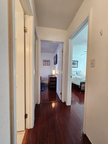 a view of a bedroom from a hallway