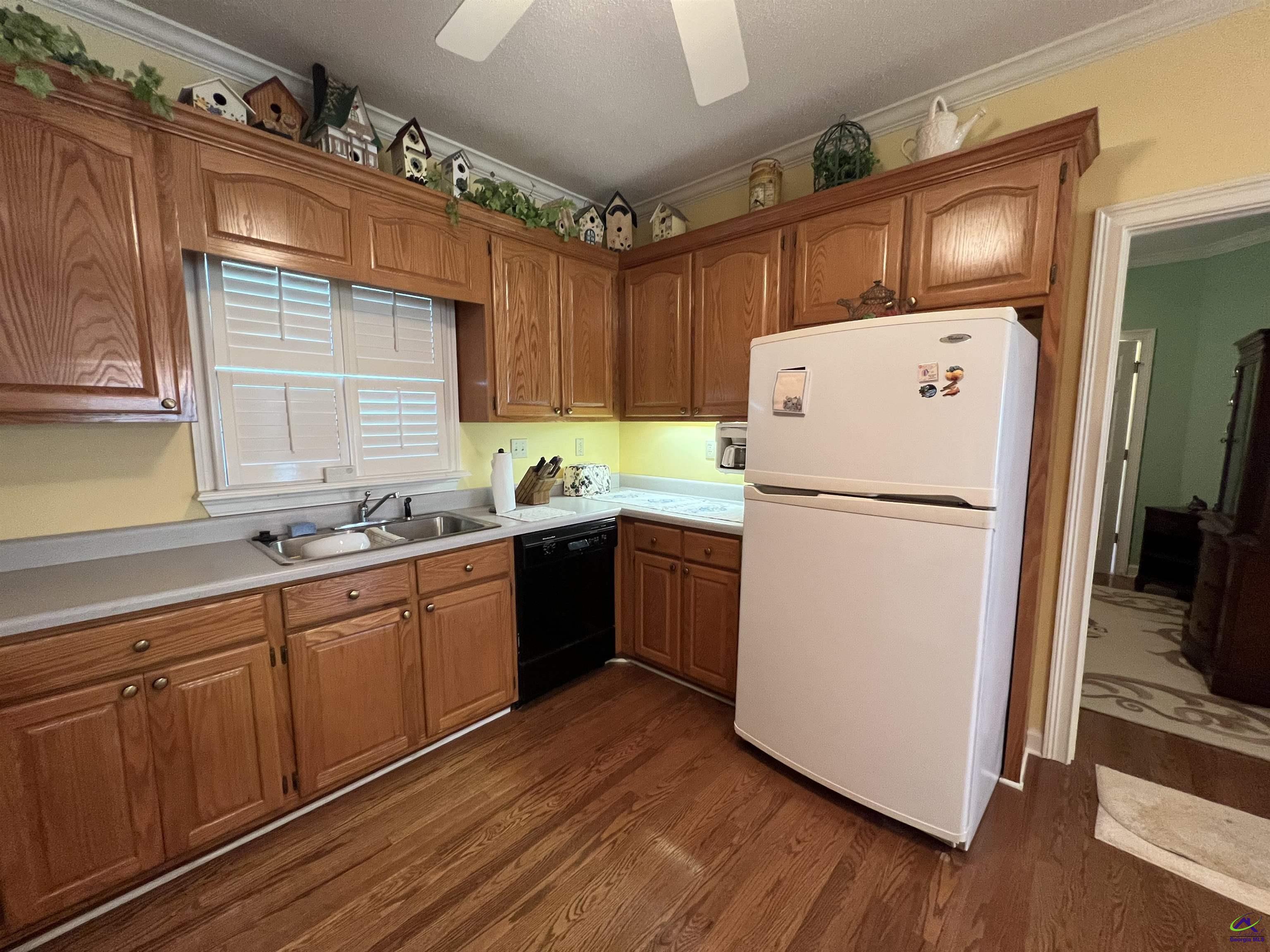 762 Nicholson-Carr Road Chester, GA 31012 - Photo 11 of 81 a kitchen with a refrigerator sink and cabinets