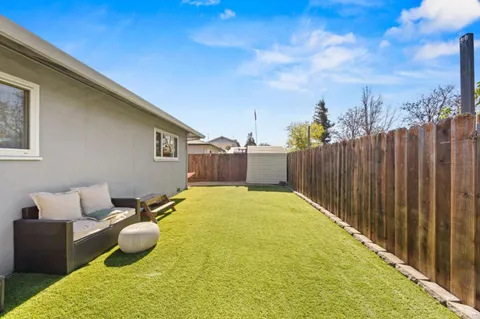 a view of a backyard with furniture