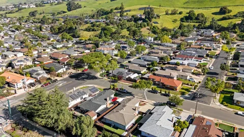 an aerial view of a city with lots of residential buildings