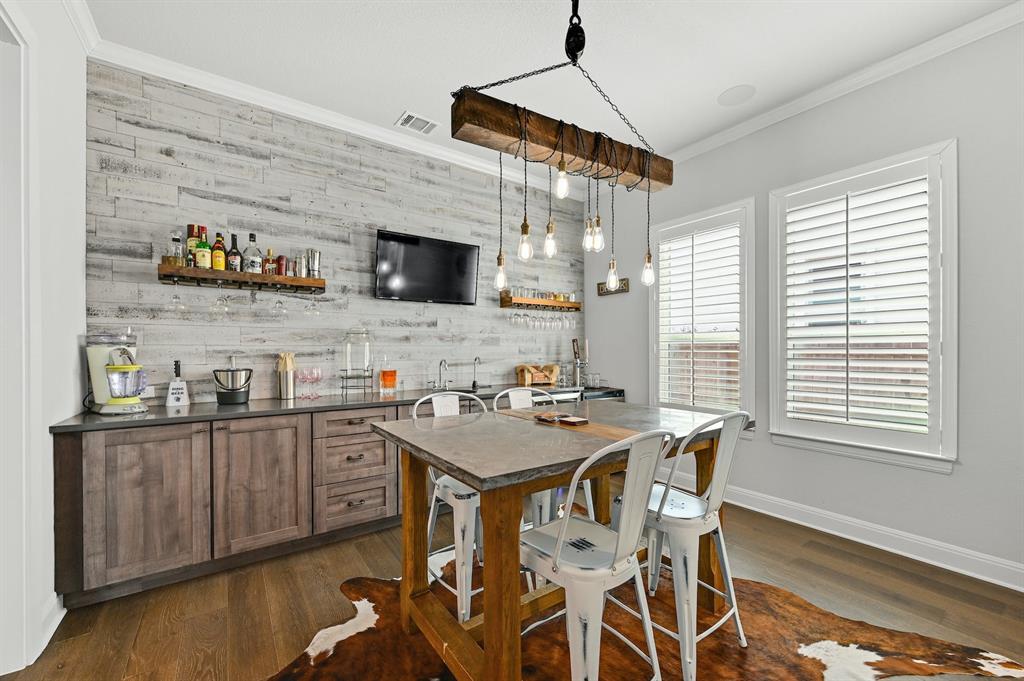 629 Germander Road Leander, TX 78641 - Photo 6 of 32 Craft a beverage in this well-appointed bar, featuring rustic accents and ample counter space.