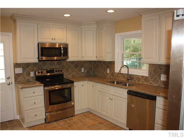 912 Brandon Road Durham, NC 27713 - Photo 5 of 22 Beautiful kitchen remodel with tile floors, granite countertops, tile backsplash... Kitchen