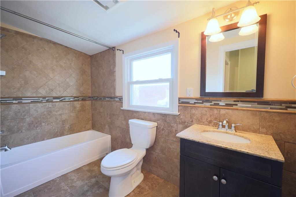 513 Lockhart Street, Unit 2 Pittsburgh, PA 15212 - Photo 17 of 21 a bathroom with a sink a toilet and shower