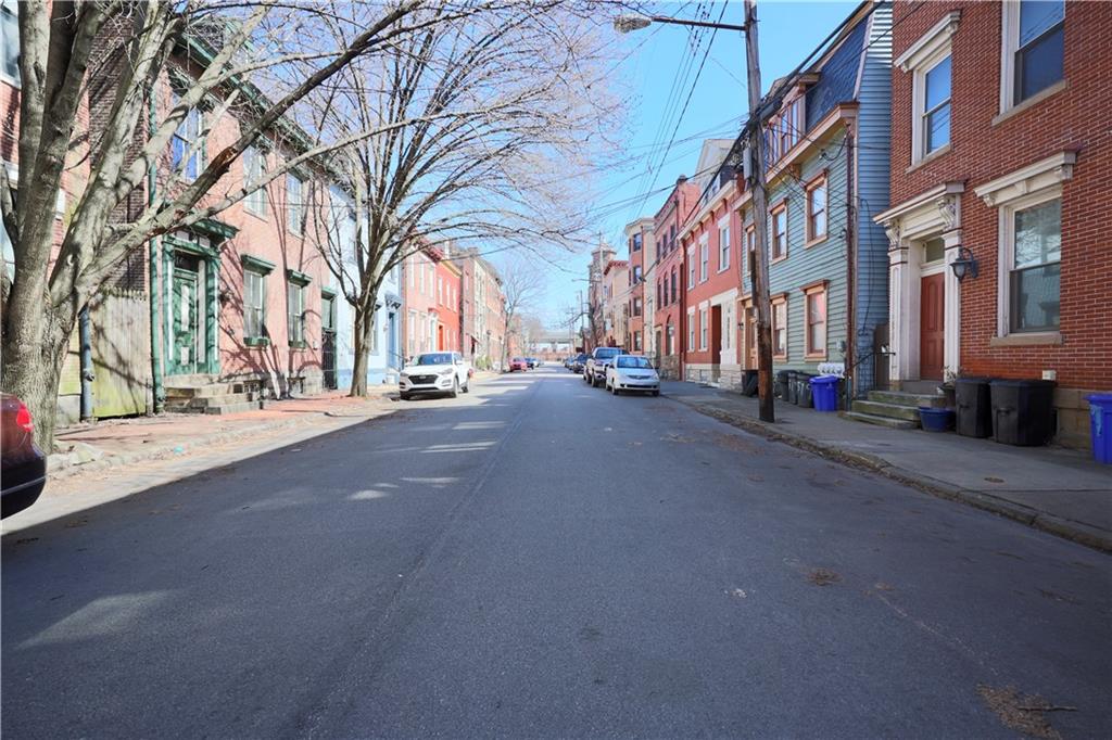 513 Lockhart Street, Unit 2 Pittsburgh, PA 15212 - Photo 2 of 21 a city street lined with buildings and trees