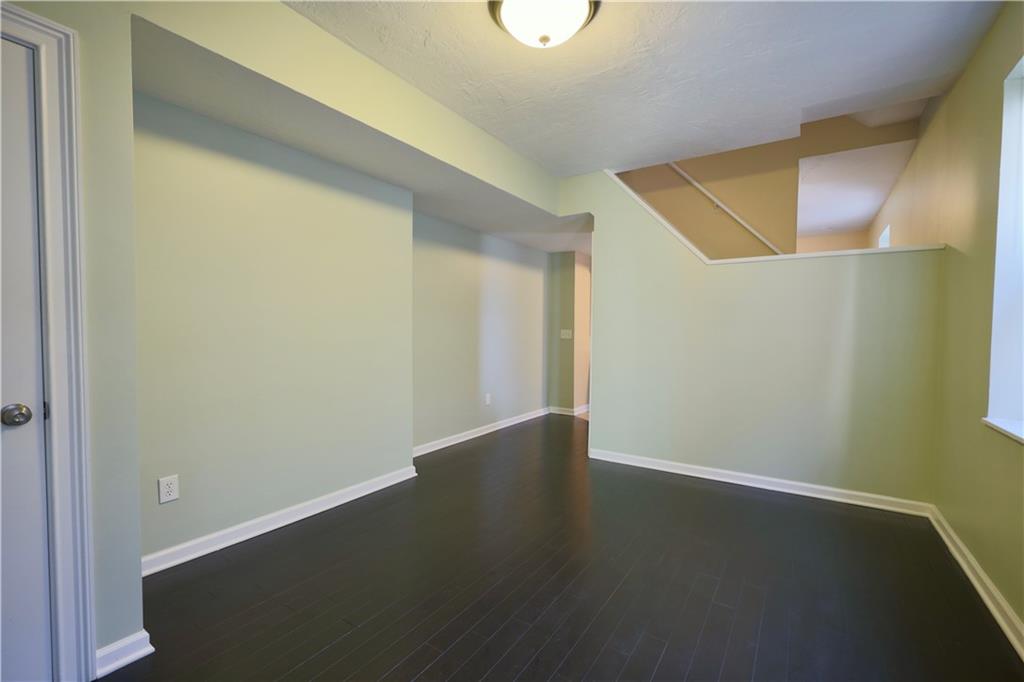 513 Lockhart Street, Unit 2 Pittsburgh, PA 15212 - Photo 4 of 21 a view of an empty room with wooden floor