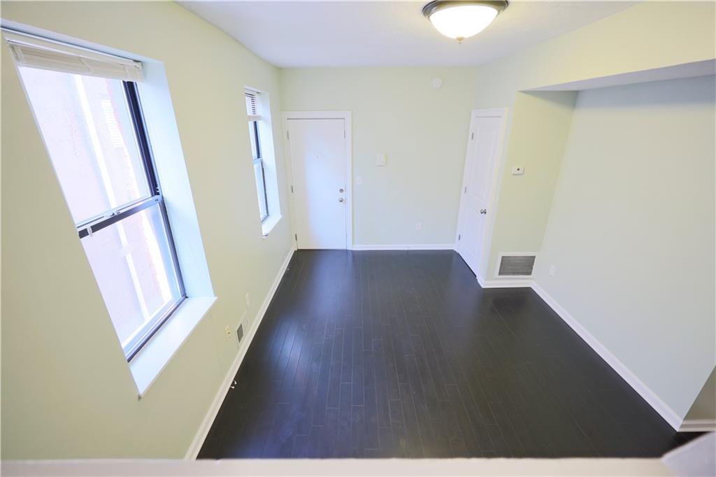513 Lockhart Street, Unit 2 Pittsburgh, PA 15212 - Photo 6 of 21 a view of a hallway with wooden floor