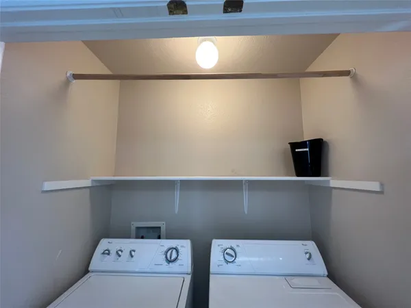 a view of a storage & utility room with washer and dryer