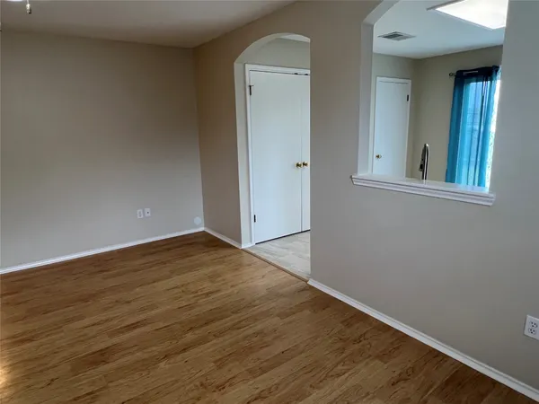 a kitchen with a refrigerator and a microwave