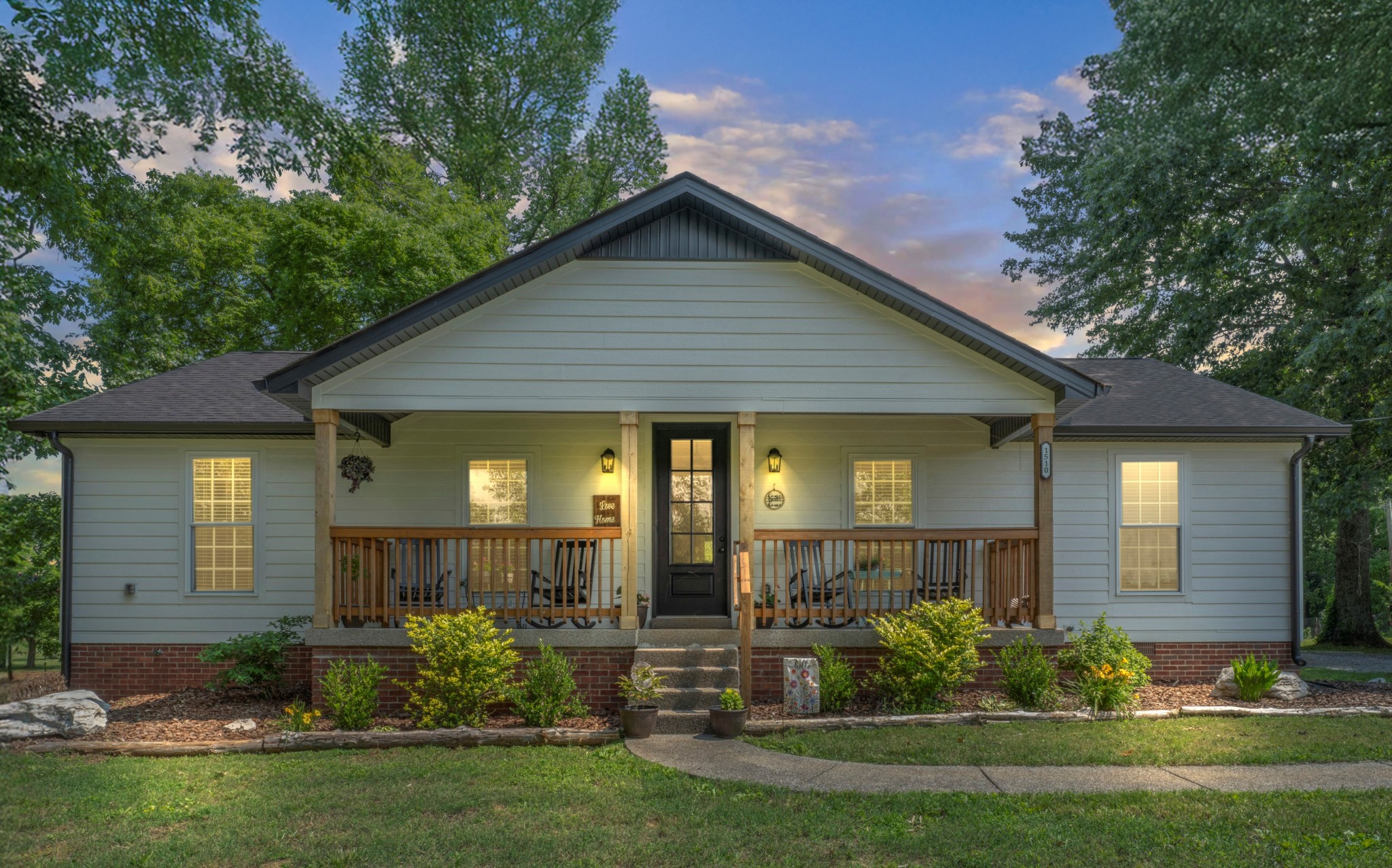 a front view of a house with a yard