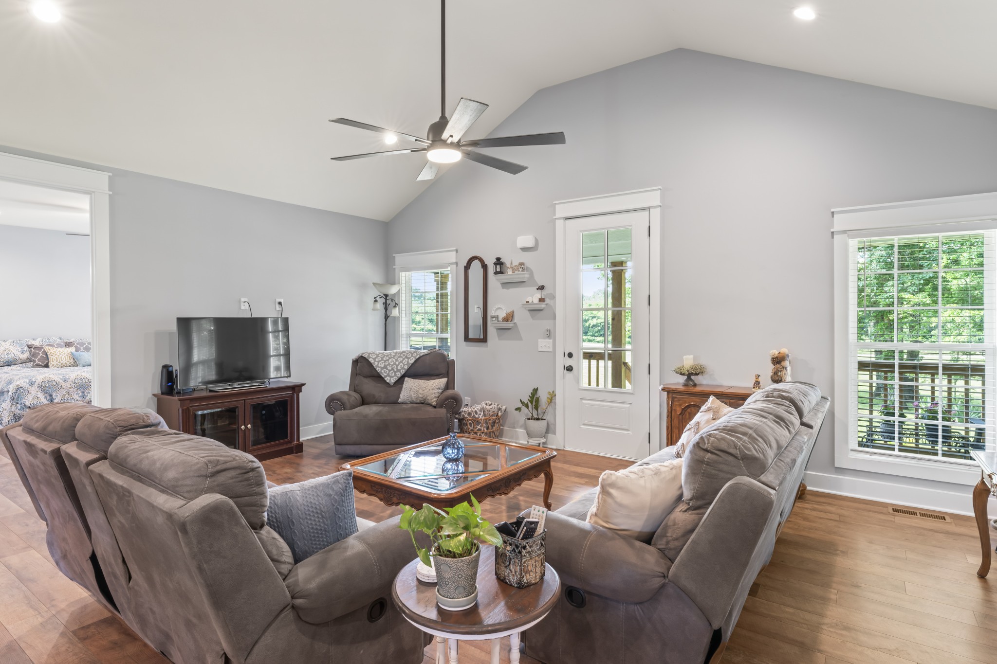 1510 Wade Brown Road Lewisburg, TN 37091 - Photo 23 of 59 a living room with furniture a flat screen tv and a large window