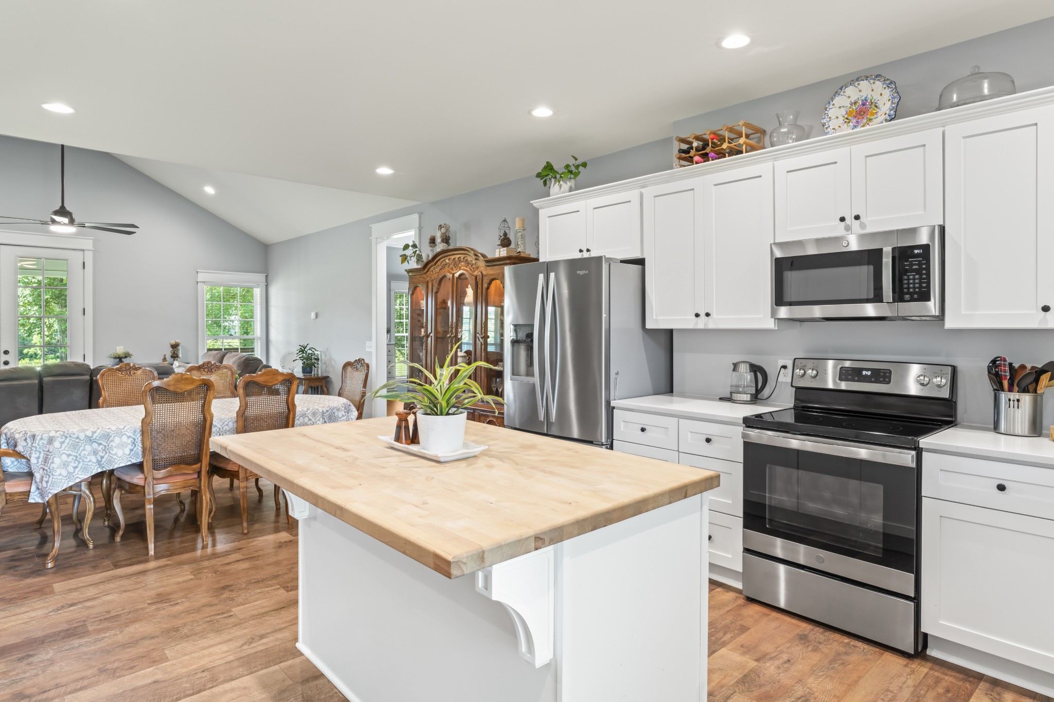 1510 Wade Brown Road Lewisburg, TN 37091 - Photo 32 of 59 a kitchen with stainless steel appliances kitchen island granite countertop a stove a sink a refrigerator a dining table and chairs