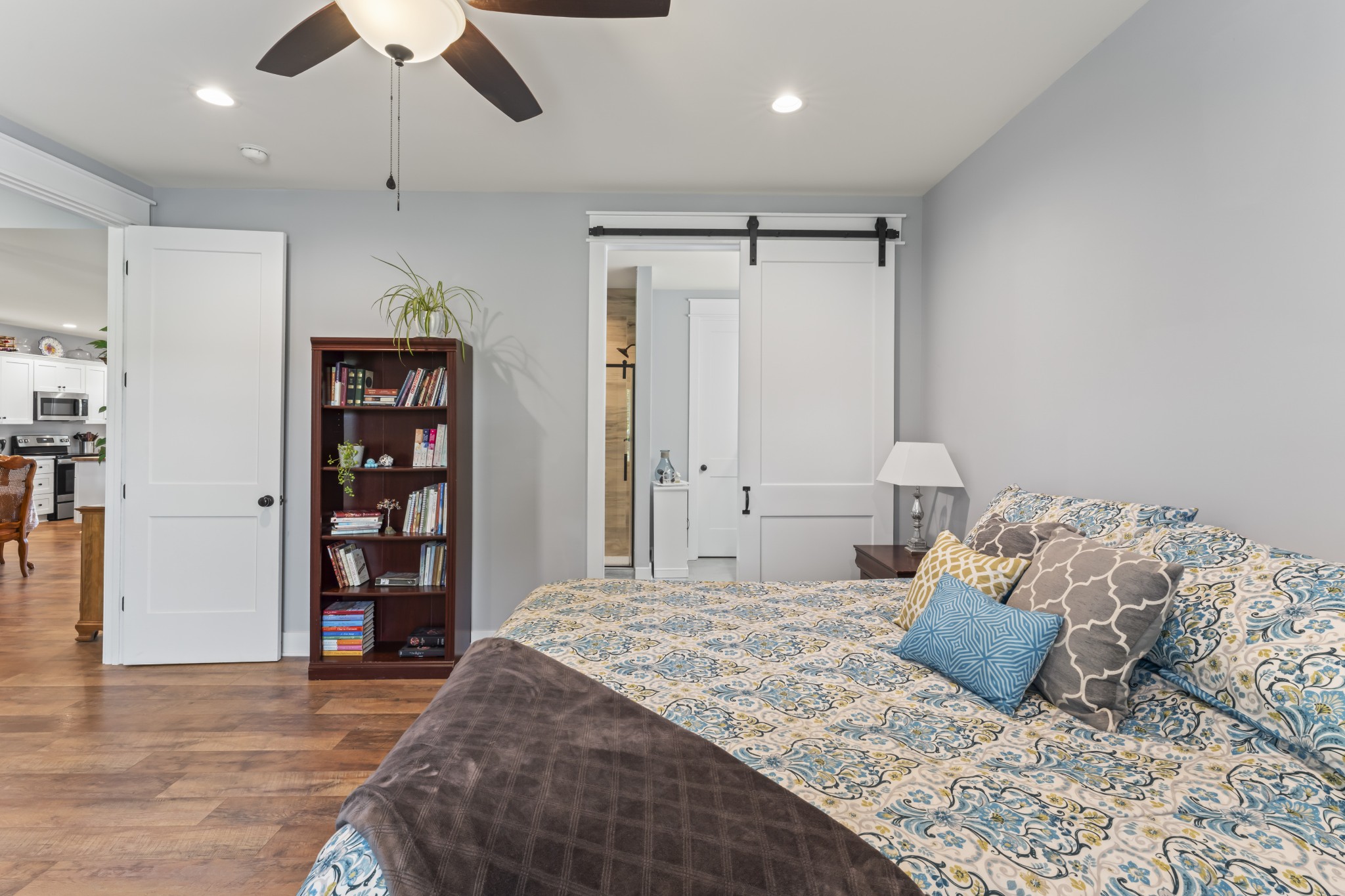 1510 Wade Brown Road Lewisburg, TN 37091 - Photo 34 of 59 a bedroom with a large bed and a book shelf