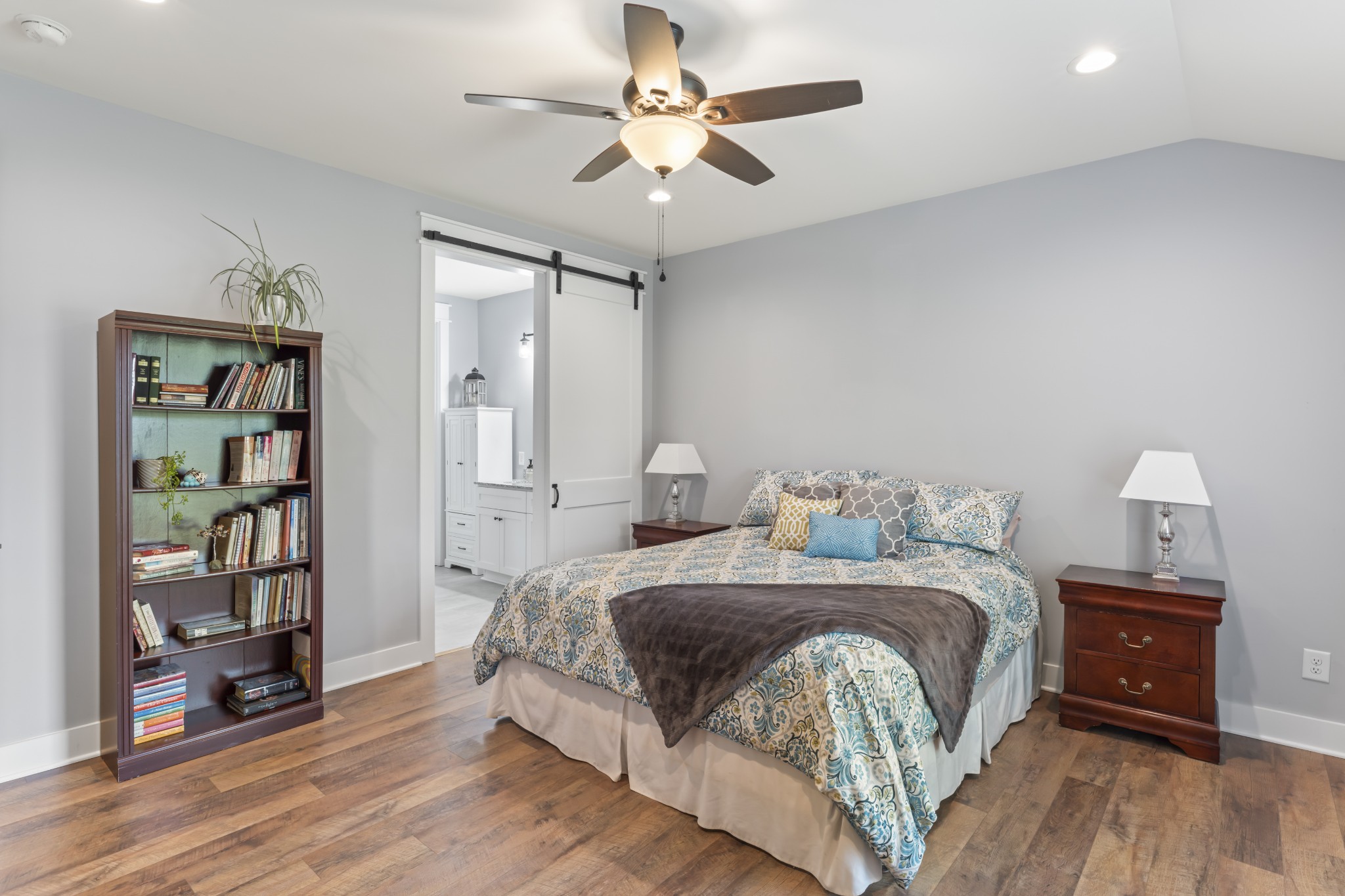 1510 Wade Brown Road Lewisburg, TN 37091 - Photo 35 of 59 a bedroom with a bed and a book shelf
