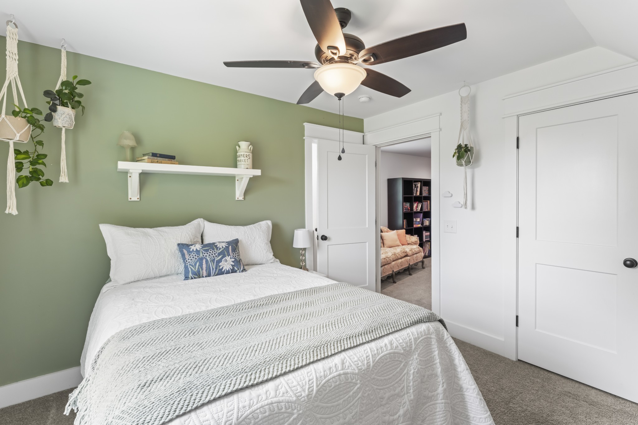 1510 Wade Brown Road Lewisburg, TN 37091 - Photo 56 of 59 a bedroom with a large bed and a chandelier