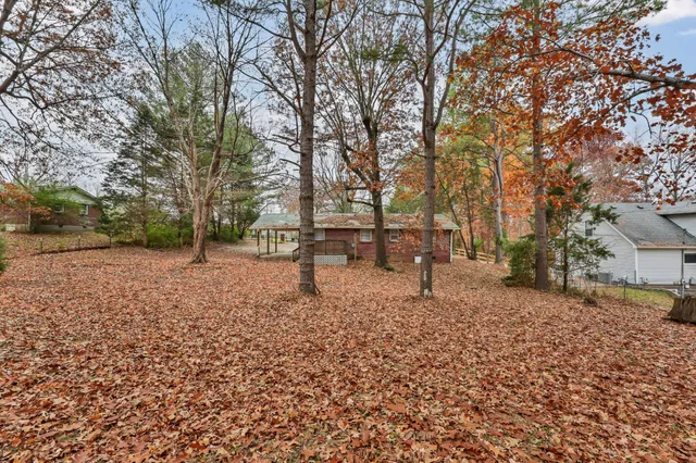 a backyard of a house with lots of green space