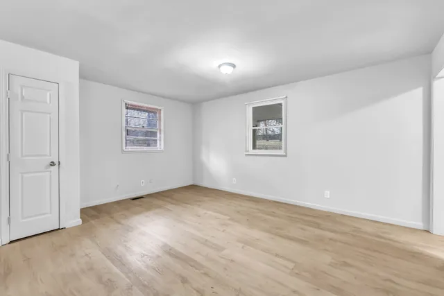 an empty room with windows