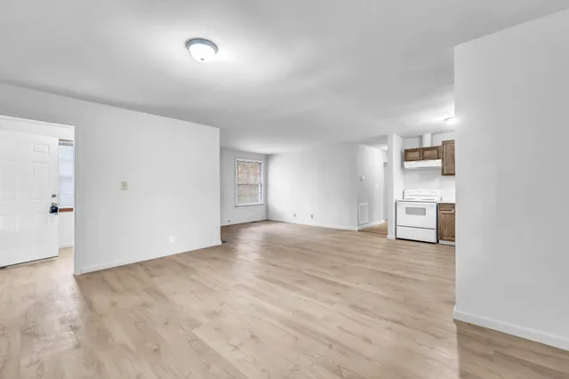 a view of a livingroom with wooden floor and closet
