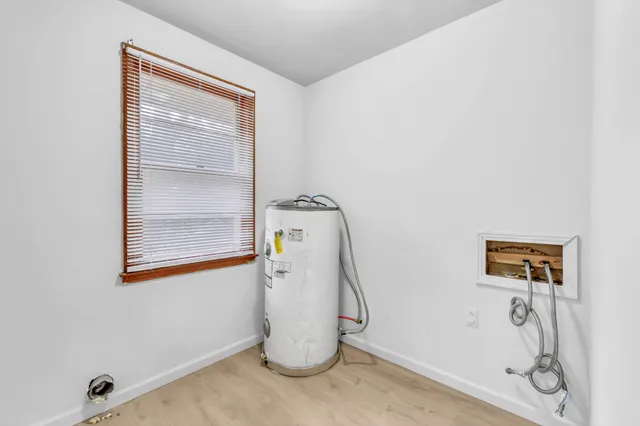 a view of a storage & utility room with a window