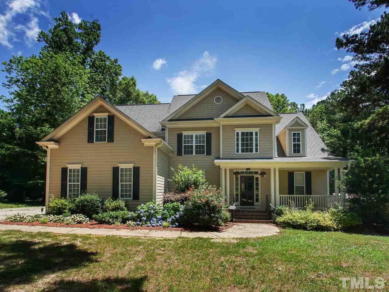 10001 Fanny Brown Road Raleigh, NC 27603 - Photo 1 of 25 a front view of a house with a yard and garage