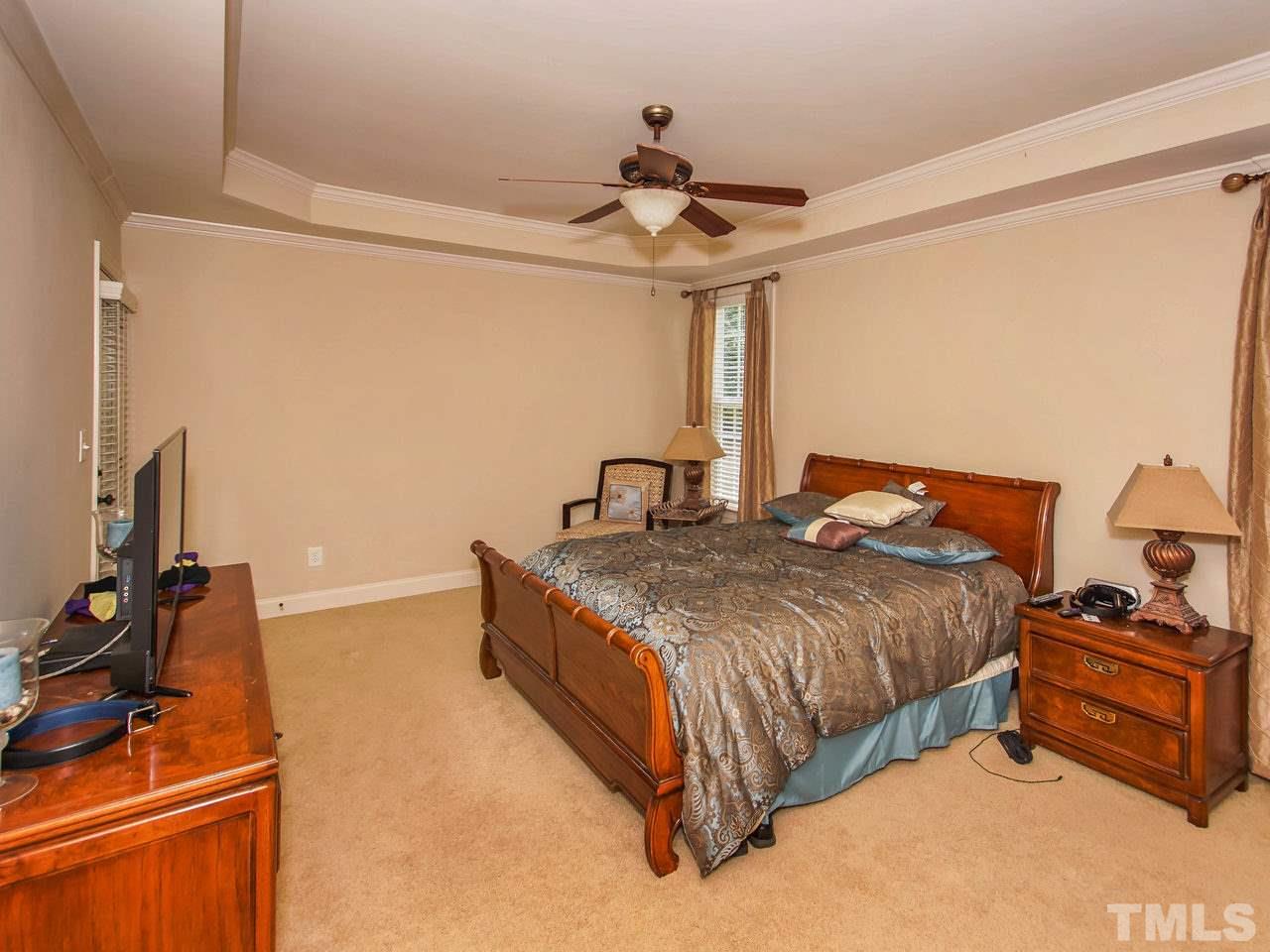 10001 Fanny Brown Road Raleigh, NC 27603 - Photo 12 of 25 a bedroom with a bed and a dresser