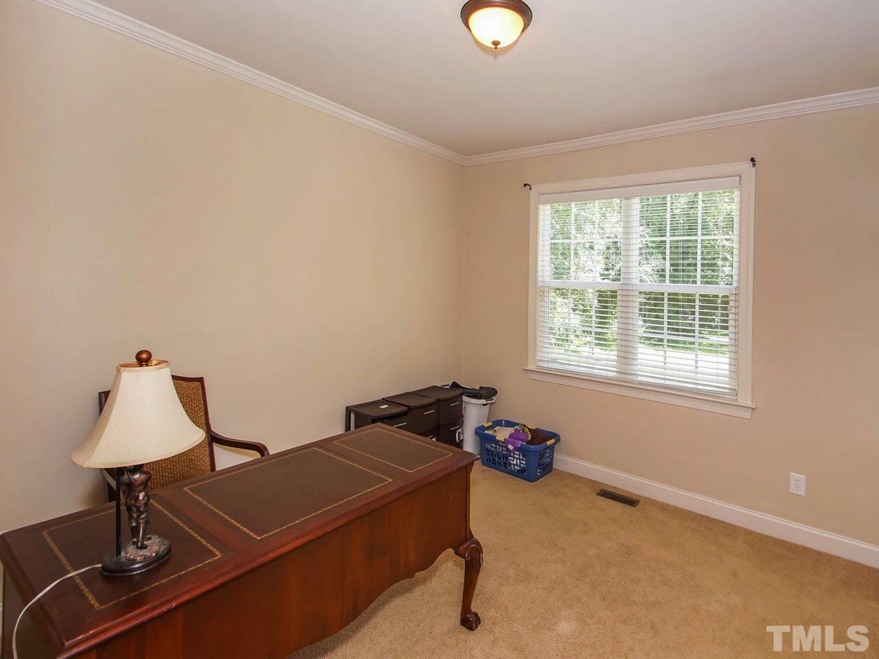 10001 Fanny Brown Road Raleigh, NC 27603 - Photo 15 of 25 a room with gym equipment and a window