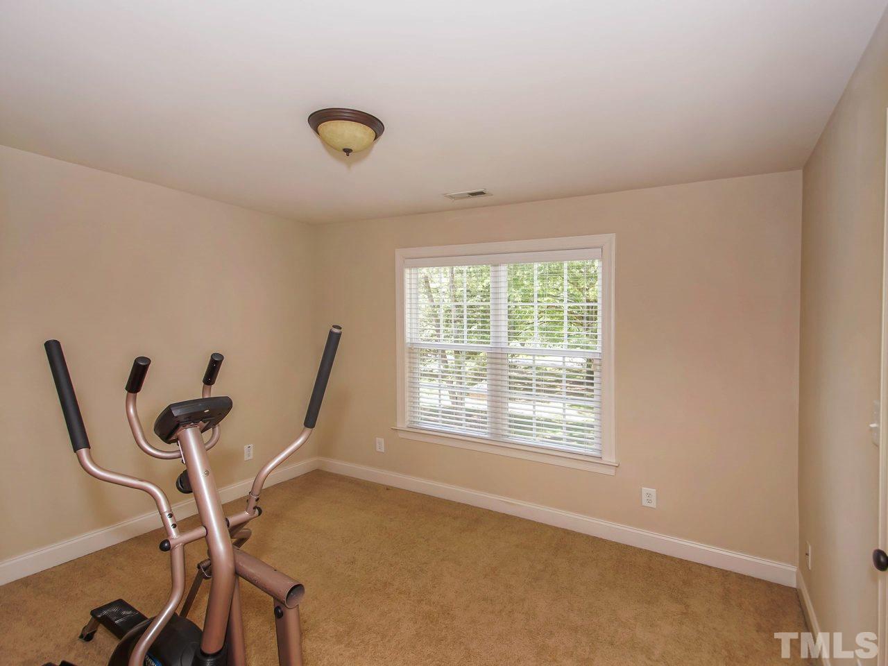 10001 Fanny Brown Road Raleigh, NC 27603 - Photo 17 of 25 a view of a workspace with furniture and a window