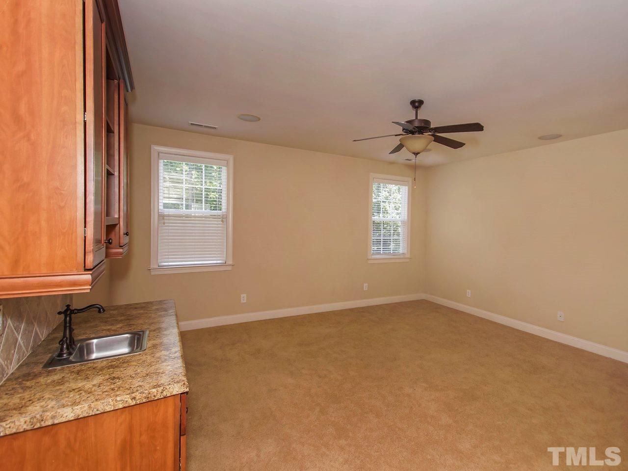 10001 Fanny Brown Road Raleigh, NC 27603 - Photo 19 of 25 a bathroom with a granite countertop sink a window and a mirror