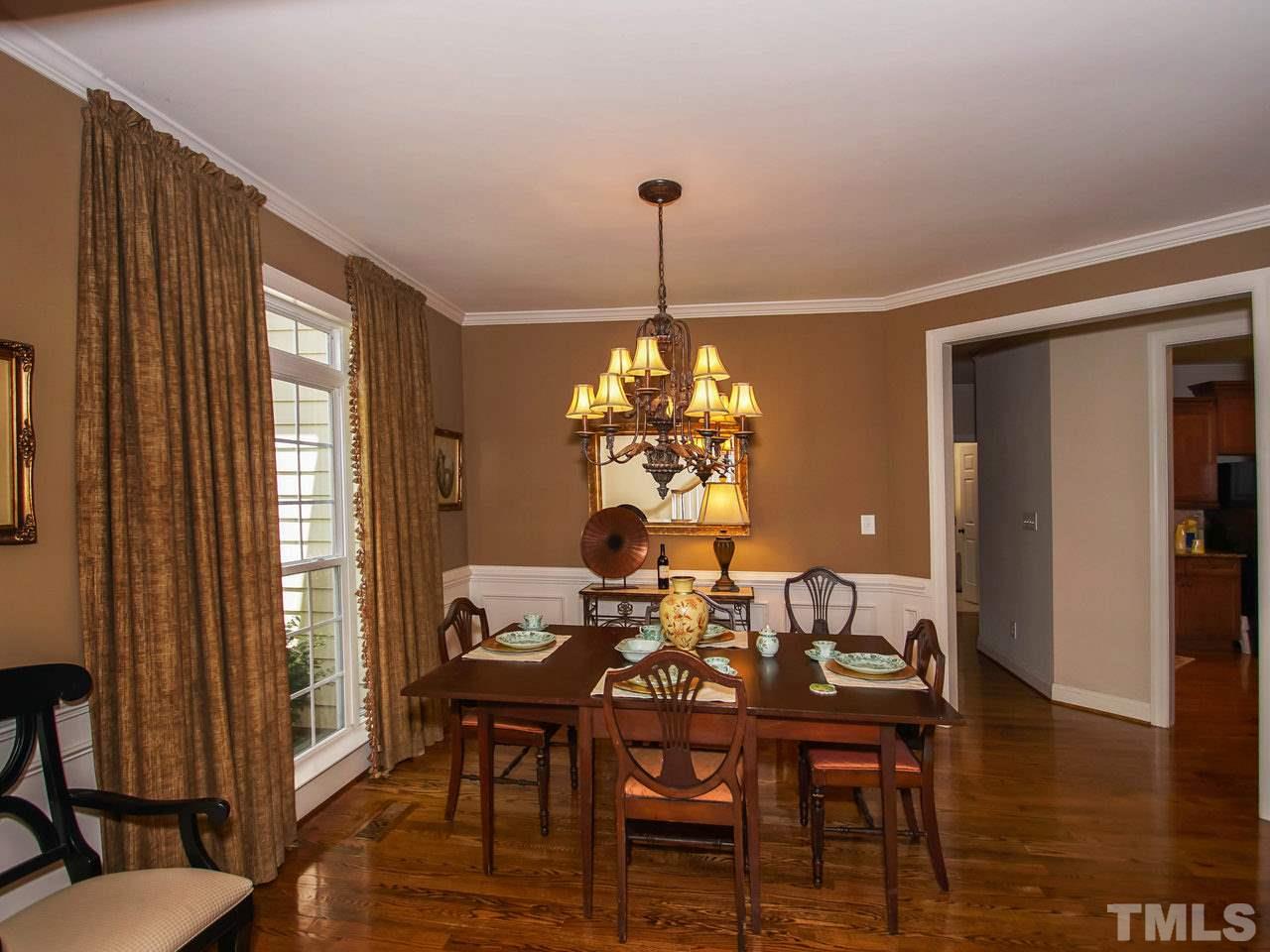 10001 Fanny Brown Road Raleigh, NC 27603 - Photo 4 of 25 a view of a dining room with furniture window and wooden floor