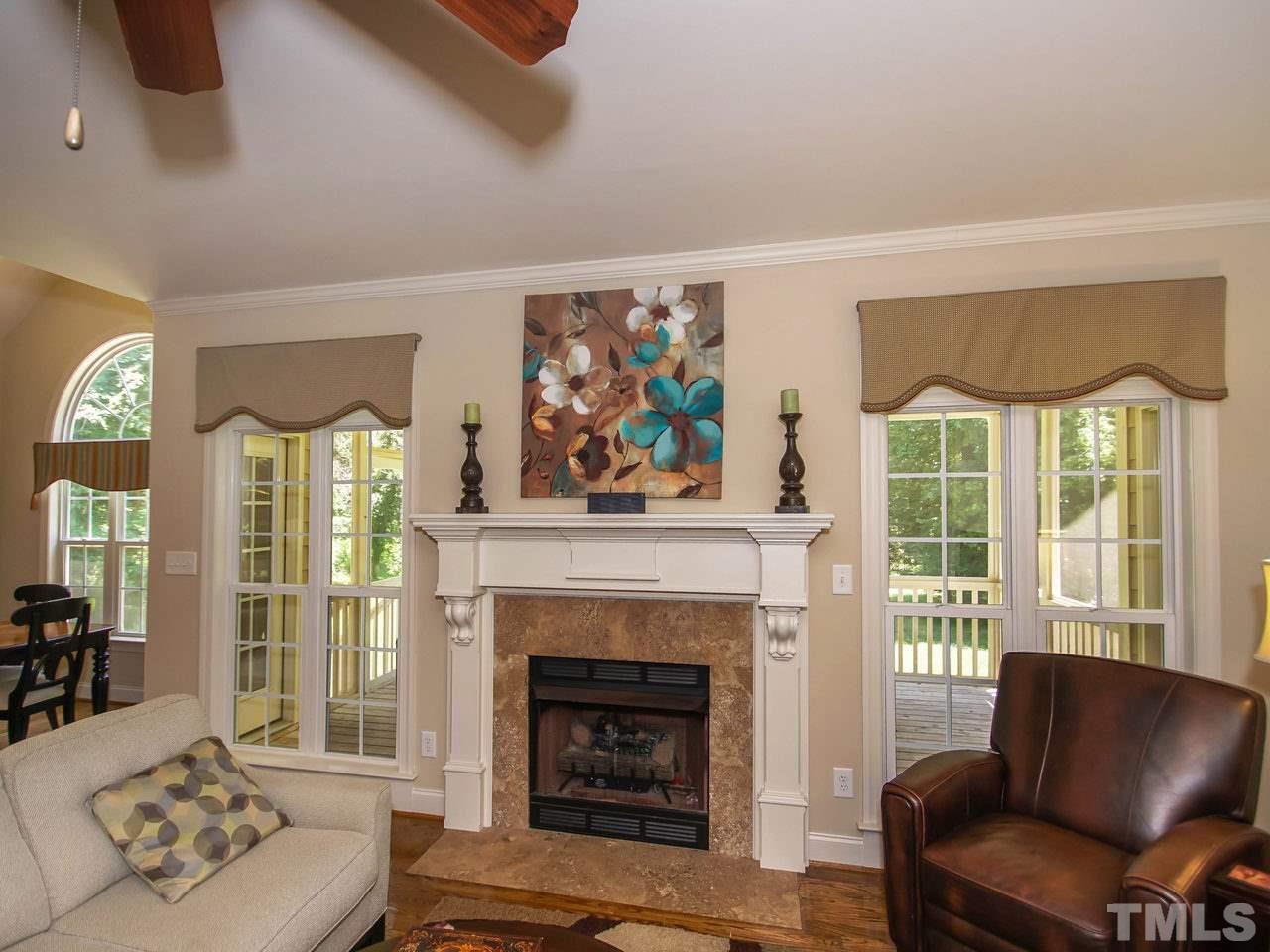 10001 Fanny Brown Road Raleigh, NC 27603 - Photo 6 of 25 a living room with furniture and a fireplace