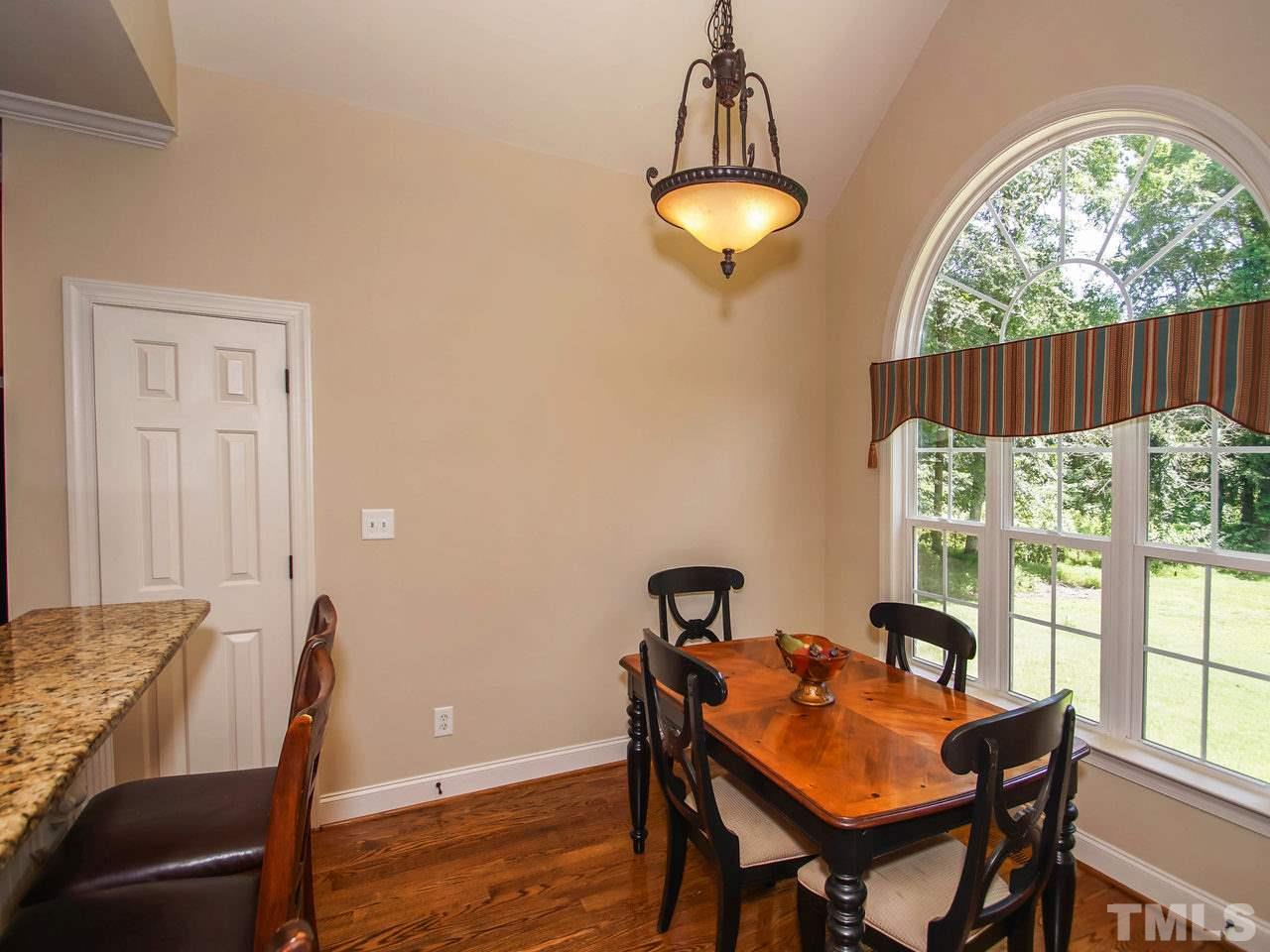 10001 Fanny Brown Road Raleigh, NC 27603 - Photo 8 of 25 a view of a dining room with furniture window and outside view