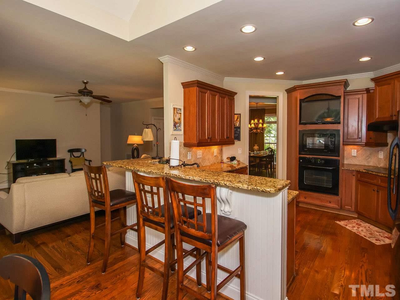 10001 Fanny Brown Road Raleigh, NC 27603 - Photo 9 of 25 a large kitchen with a table and chairs