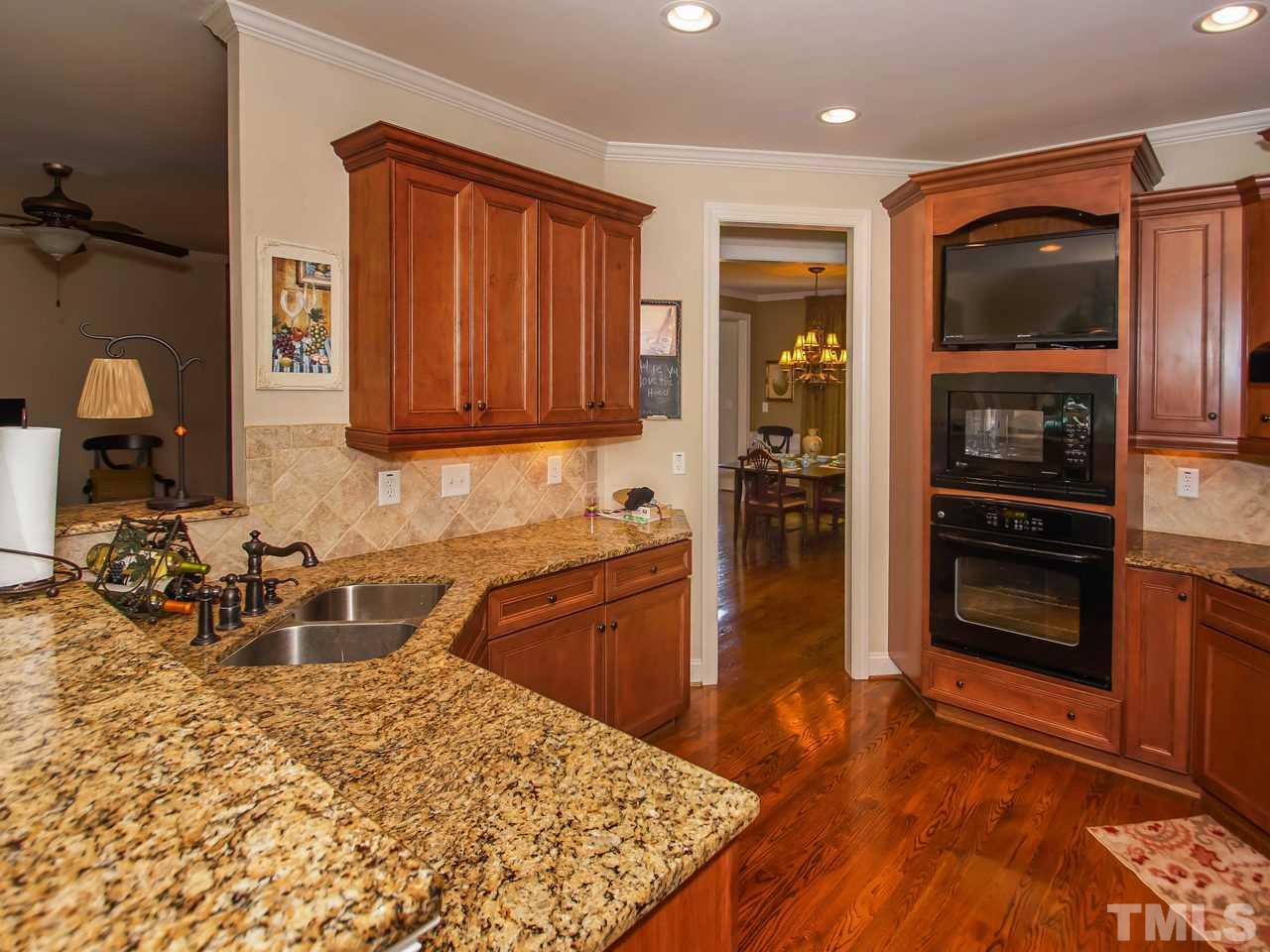 10001 Fanny Brown Road Raleigh, NC 27603 - Photo 10 of 25 a kitchen with a refrigerator and a sink