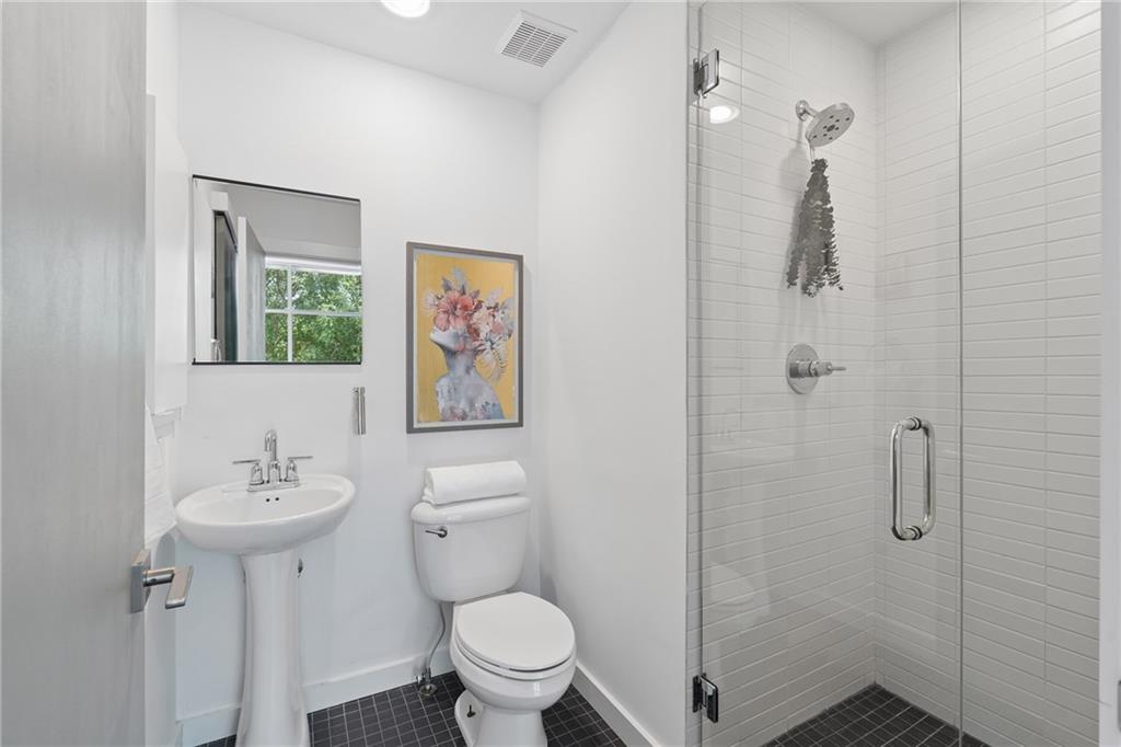 752 Moreland Avenue Southeast, Unit 4 Atlanta, GA 30316 - Photo 36 of 58 a bathroom with a toilet sink and shower
