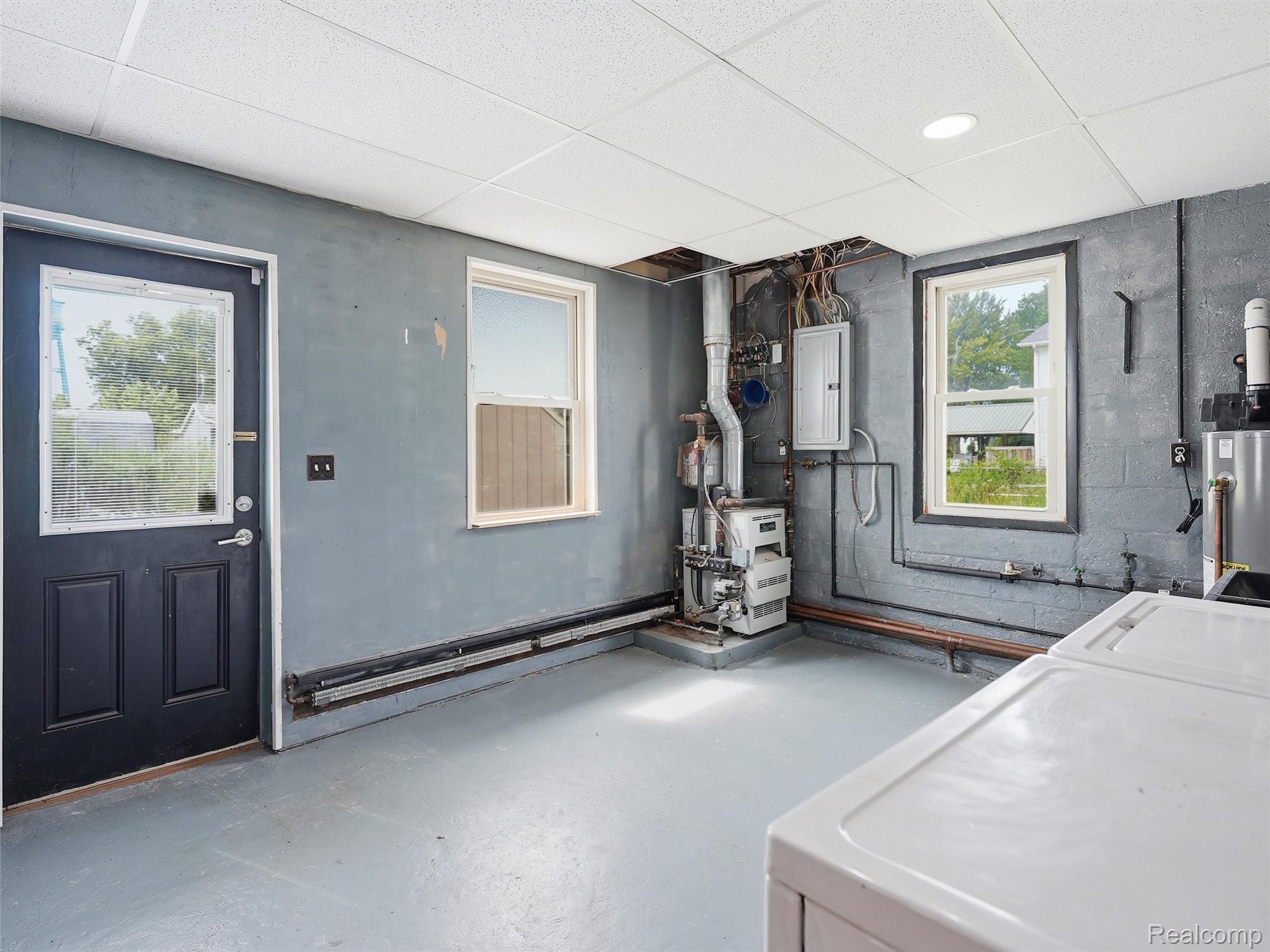 117 Kenyon Road Algonac, MI 48001 - Photo 23 of 47 Utility room featuring painted concrete block walls and a drop ceiling with recessed lighting