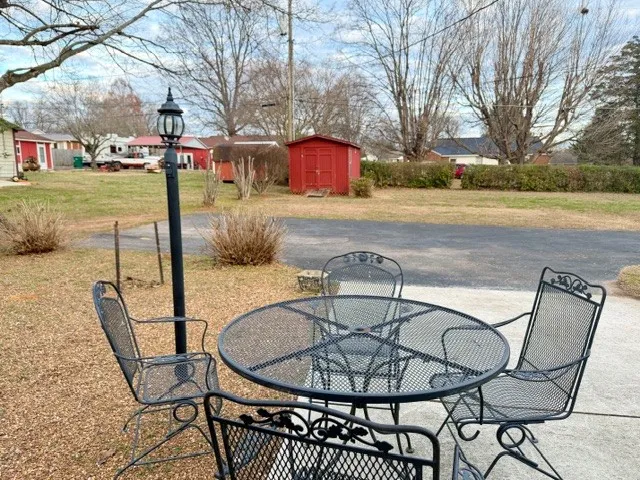 a view of a swimming pool with a patio