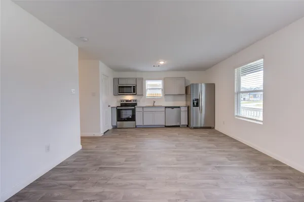 a view of a kitchen with a sink cabinets and a window